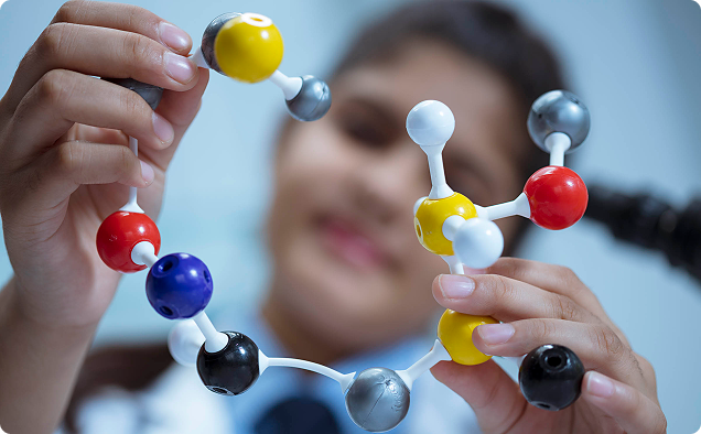 Student with science model